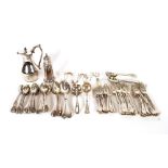 A large quantity of various plated cutlery; a plated hot milk jug; a plated sugar sifter etc.