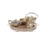 A miniature silver tea pot and tea kettle on stand, Birmingham 1908; a matching silver and oak two