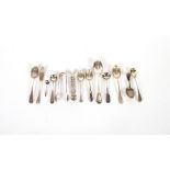A small collection of various silver teaspoons, condiment spoons, sugar nips and a butter knife,