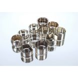 A collection of eleven various silver napkin rings, 186gms