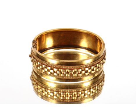 A yellow metal snap bangle,&nbsp;engraved '16th Annual Prize Meeting, Won By F.A. Conyers', tested as 14ct gold with 9ct gold