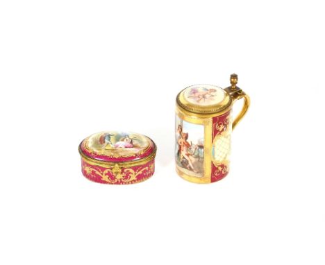 A late 19th Century Dresden porcelain miniature lidded tankard,&nbsp;and a similar late 19th Century Ormolu mounted hand pain