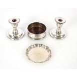 A pair of silver dwarf candlesticks, Birmingham 1905, with loaded bases AF, 9cm high; a silver pie