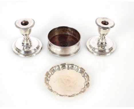 A pair of silver dwarf candlesticks,&nbsp;Birmingham 1905, with loaded bases AF, 9cm high; a silver pie crust bordered coaste