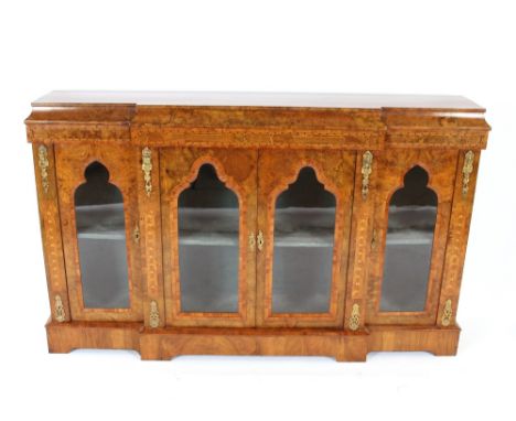 A 19th Century walnut and Tunbridge banded breakfront credenza,&nbsp;embellished with gilt metal mounts, the interior fabric 
