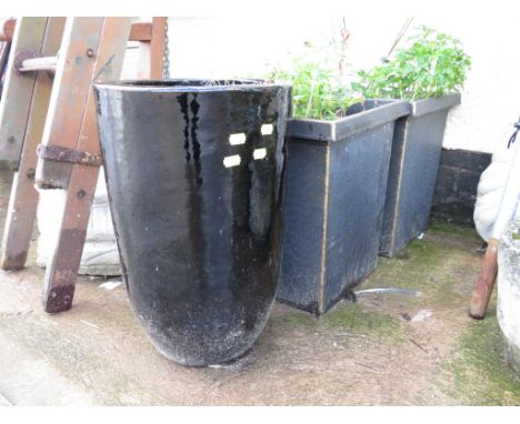 BLACK GLAZED CERAMIC PLANTER AND TWO SQUARE PLASTIC PLANTERS, ALL WITH CONTENTS