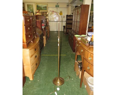 BRASS ADJUSTABLE STANDARD LAMP ON A STEPPED CIRCULAR BASE
