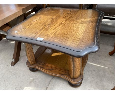 A SQUARE OAK COFFEE TABLE WITH LOWER SHELF 