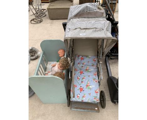 A VINTAGE DOLLS PRAM AND COT WITH THREE DOLLS 