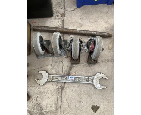 A LARGE KING DICK SPANNER, A LARGE SPRING AND FOUR CASTORS 