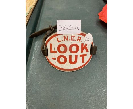 AN ENAMEL LNER LOOK OUT ARMBAND WITH LEATHER STRAP 