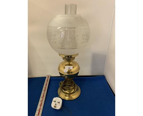A BRASS OIL STYLE LAMP WITH GLASS SHADE 