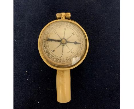 A VINTAGE COMPASS 