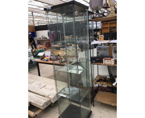 A THREE SHELF GLASS DISPLAY CABINET 