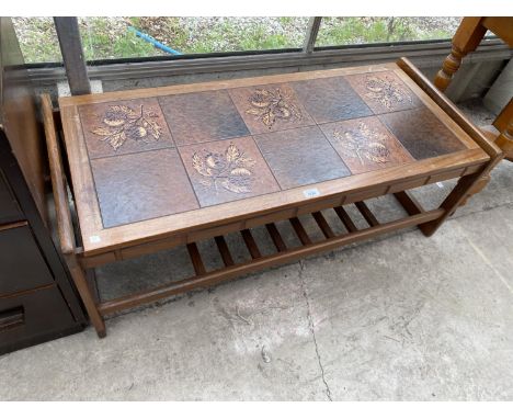 A RETRO TEAK COFFEE TABLE WITH TILED TOP AD LOWER SHELF 