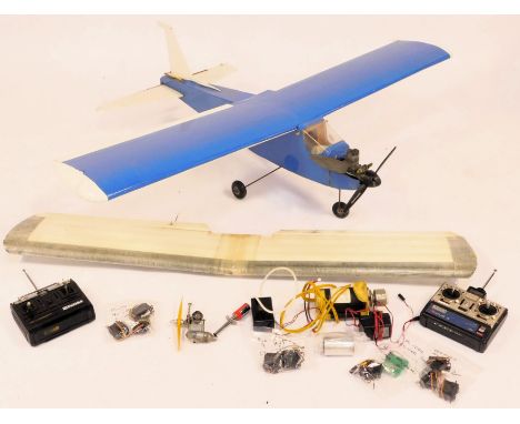 A remote controlled biplane, in blue, with engine, etc.