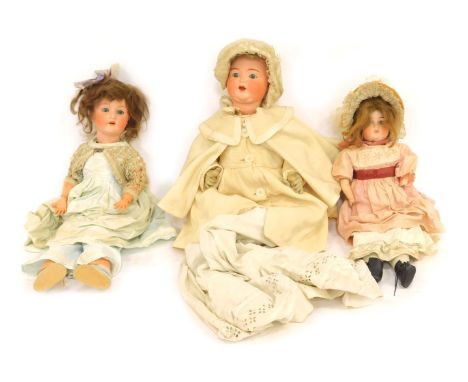 Three ceramic headed dolls, comprising an Armand Marseilles bisque headed doll stamped 996A11M, a further Armand Marseilles 2