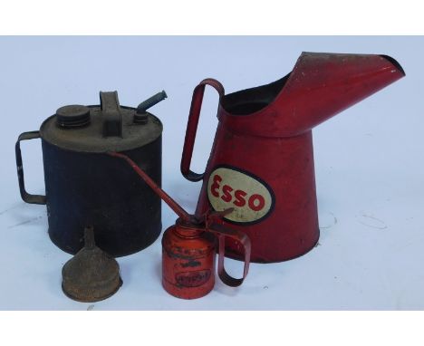 An Esso oil jug, in red, 32cm high, together with a Wesco oil can, funnel, and a galvanised metal oil can. (4)