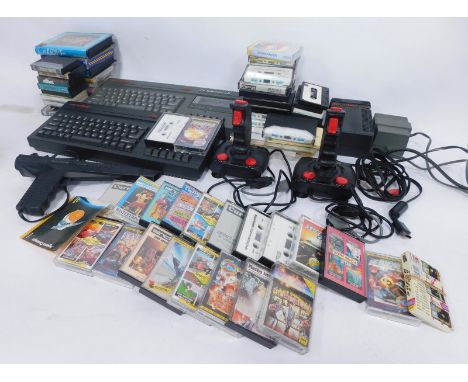 Sinclair ZX Spectrum +2 128k consoles, with joysticks, light gun, power packs, instructions, and games cassettes. (a quantity