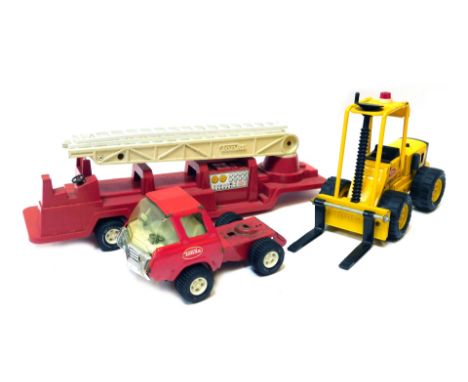Tonka toys, including a Tonka forklift and a Tonka fire engine and tender. 