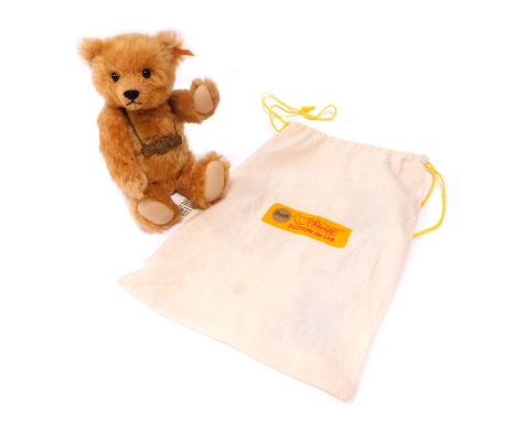 A Steiff Centenary bear, with growler, 1920-2002, blonde mohair, 30cm high, with certificate, in cloth bag.