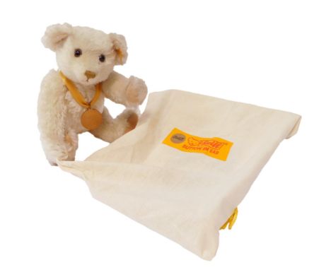 A Steiff The Millennium Teddy bear, in white mohair, 654701, 32cm, with certificate, in cloth bag.