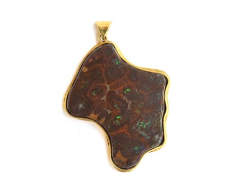 A large boulder opal pendant mounted in gold, tests as 18ct, 16.9g 