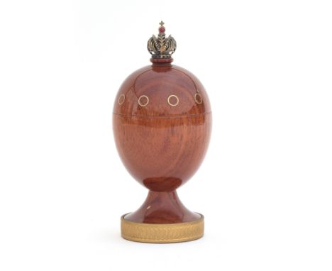 A Theo Fabergé (1922-2007) St. Petersburg Collection 'Eternity Egg', turned bubinga wood surmounted by a cabochon ruby set im