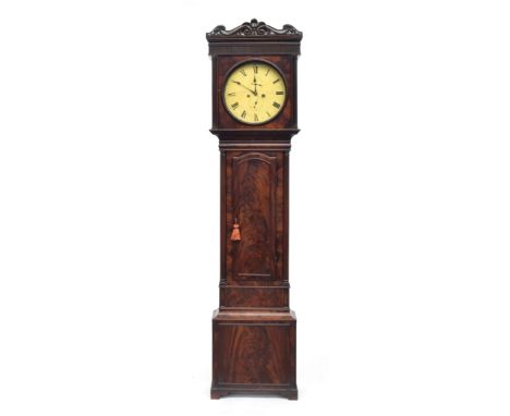 A Victorian mahogany longcase clock, carved pediment over a 14" dial with Roman numerals, the dial and trunk flanked by reede