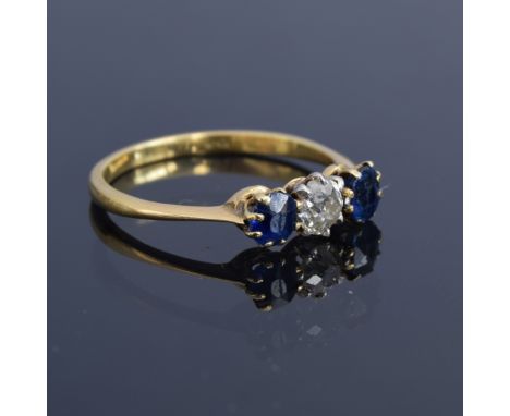 An 18ct gold, sapphire and diamond trilogy ring, size R, 2.5g