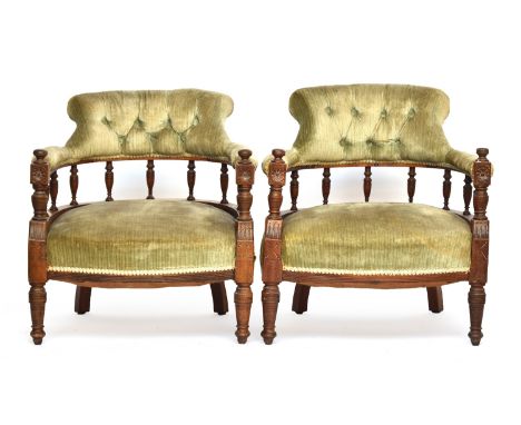 A pair of late Victorian button upholstered low tub chairs 