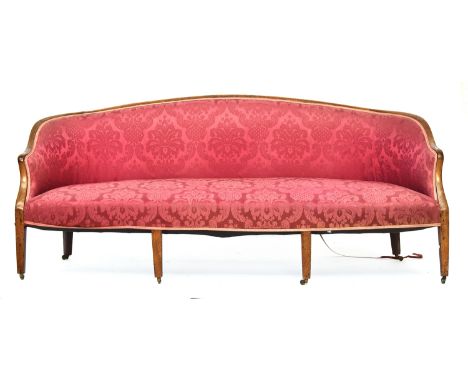 A 19th century mahogany framed three seater sofa in Hepplewhite style, on square tapered legs with brass casters, 195cm wide 