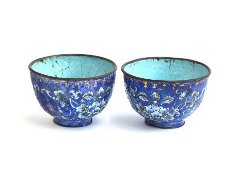 A pair of Chinese Canton enamel cups, cobalt blue ground decorated with scrolling florals, heightened in gilt with the symbol