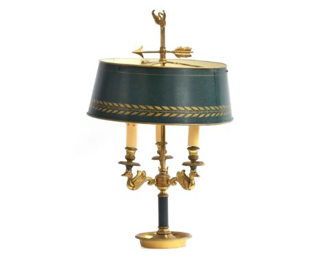 A gilt brass bouillotte lamp with adjustable green tole shade over three fittings, each supported on ducks, on a reeded eboni
