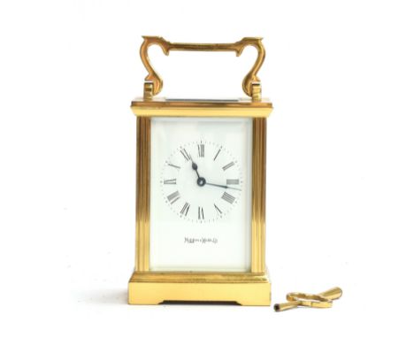 A Mappin &amp; Webb brass cased carriage clock, bevelled glass and enamel dial, with key 15cm high 
