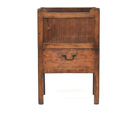 A George III tray top commode, the three quarter gallery with pierced handles, over a tambour front, and original pull out co
