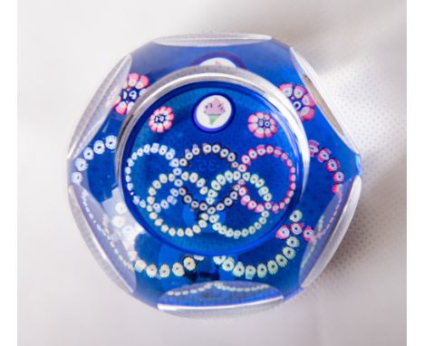 A Whitefriars glass PL526 Moscow Olympic Games paperweight, 6+1 window cut featuring the Olympic torch mosaic silhouette cane