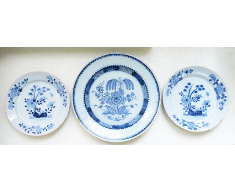 A DELFTWARE DISH, POSSIBLY IRISH, PAINTED WITH A WEEPING TREE AND PEONY IN DIAPER CAVETTO, 30CM D AND A PAIR OF ENGLISH DELFT