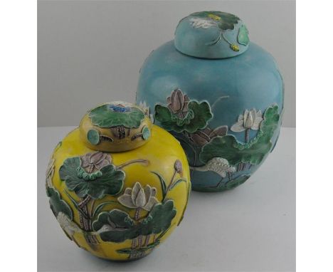 Two similar Chinese Wang Bing Rong ginger jars, with typical relief floral decoration. Seal marks to base. Blue jar has some 