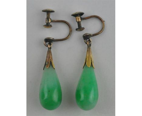 A pair of jade drop earrings, of teardrop form, set in yellow metal&nbsp;mount with screw back fitting, (yellow metal assesse