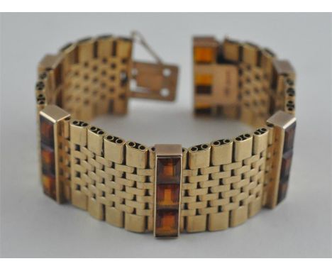 A fine Garrard & Co. retailed 9ct. gold and hessonite bracelet, maker EJ LD., London hallmarked 9 carat, having sets of gold 