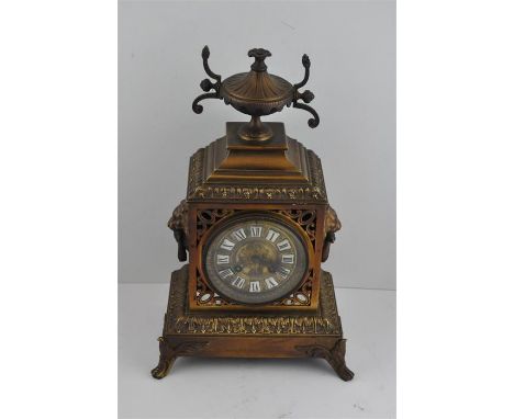 A&nbsp;French brass mantle clock, late 19th century,&nbsp;bell strike movement, having circular gilt cast brass dial with whi