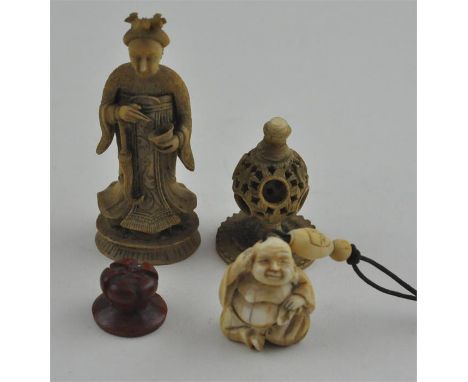 A Japanese late Meiji period carved ivory netsuke of Hotei, sat cross legged, signed, height 3.5 cm., together with a Chinese