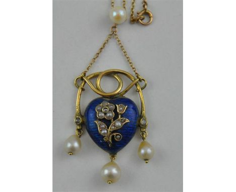 An Art Nouveau enamel and&nbsp;yellow metal heart pendant, having cobalt blue enamelled heart with raised yellow metal flower