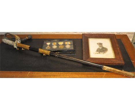 An 1827 pattern Royal Navy officer's&nbsp;sword, having brass dish guard incorporating crowned anchor, lion's head pommel, sh