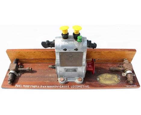 Ruston &amp; Hornsby Narrow Gauge Locomotive Fuel Pump mounted on a display board and includes the brass Worksplate alongside