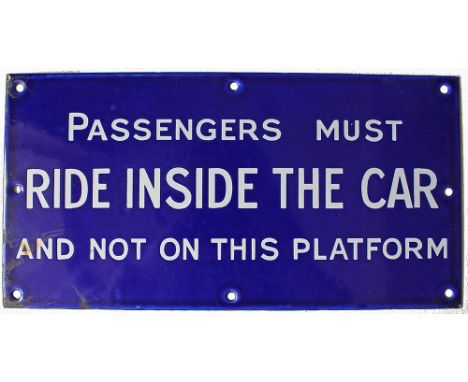 Enamel sign PASSENGERS MUST RIDE INSIDE THE CAR AND NOT ON THIS PLATFORM, white lettering on royal blue ground measuring 11.7