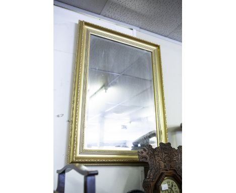A GILT FAMED OBLONG  WALL MIRROR