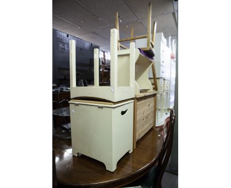 A WHITE WROUGHT IRON CORNER TWO TIER TABLE, WITH GLASS TOPS, A WHITE PAINTED DRESSING STOOL, A BATHROOM STOOL, A PINE TRUNK A