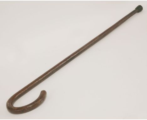 A heavy leather covered iron prison guard's or watchman's walking stick